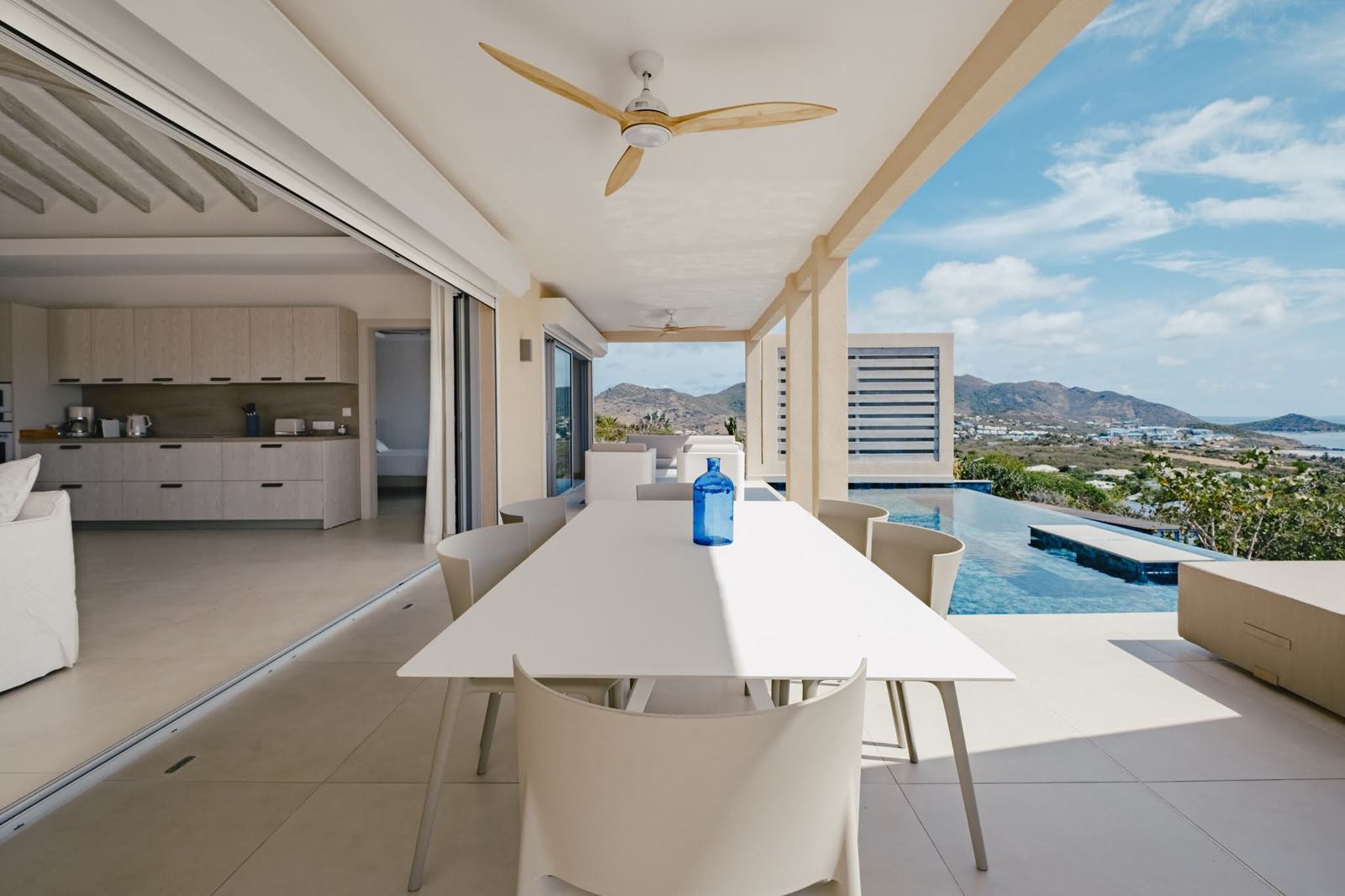 Covered terrace with pool view